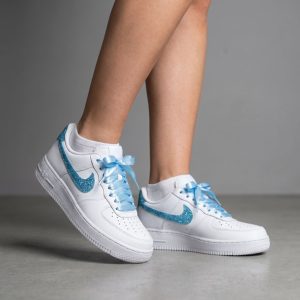 woman wearing customised nike af1 with blue glitter swoosh